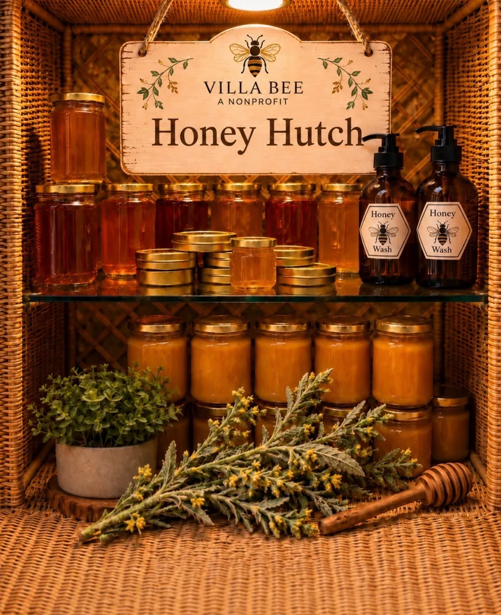 The Villa Bee Honey Hutch: shelves of honey jars and Honey Wash bottles under a Villa Bee sign